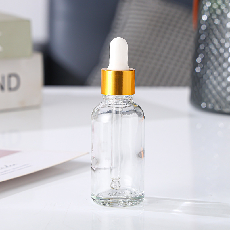 ขวดหยดแก้วใส + แหวนทอง + ยางสีขาว