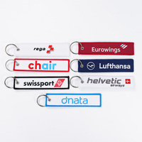 Llavero personalizado de avión con logo bordado a doble cara para promoción