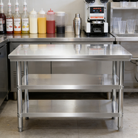 Mesa de Trabajo de Dos Niveles con Patas de Tubo, Acabado Mate Cepillado de Acero Inoxidable para Cocina Comercial, Capacidad de Carga de 300 kg/m