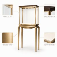 Vitrine à bijoux sur pied sur mesure avec cadre en acier inoxydable finition or, vitrine en verre et éclairage LED