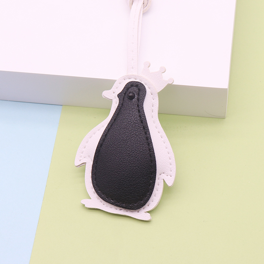 Pingouin à face noire sur blanc