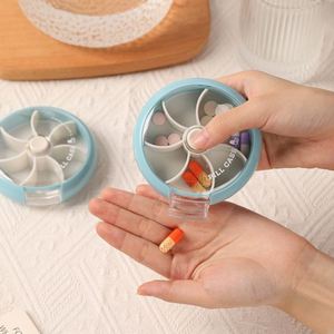 กล่องยาพลาสติกแบบหมุนได้ 7 ช่อง สำหรับพกพา จัดเก็บยาและขนมขนาดเล็ก - Product Image 1