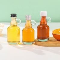 Mini bouteille de sirop en verre transparente de 40ml 50ml avec poignée en boucle pour le stockage de miel de sirop d'érable