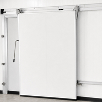 Porte coulissante industrielle CRYOMAX MCRSD pour chambre froide moyenne avec rail intégré, bloc de levage et dispositif d'évacuation d'urgence