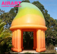 Tente gonflable en forme de mangue pour stand de jus en plein air, idéale pour la publicité et la décoration.
