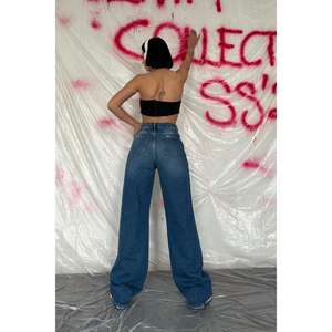 Pantalon évasé taille haute en jean bleu découpé au laser pour femme, respirant, coupe large, taille XL, en denim foncé, vente en gros - Product Image 1