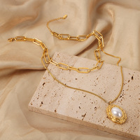 Collier chic vintage plaqué or à double rangs de chaînes, pendentif ovale imitation perle texturée, en acier inoxydable