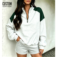 Pull-over molletonné en coton éponge de haute qualité pour femme, avec col montant zippé, imprimé et empiècements color block, collection automne-hiver, idéal pour la détente (OEM/ODM)