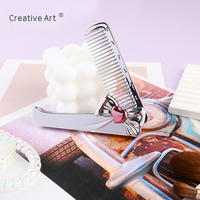 Nouveau modèle de mini peigne à cheveux Brosse à cheveux et peigne de voyage pliants de luxe avec marque privée Vente en gros