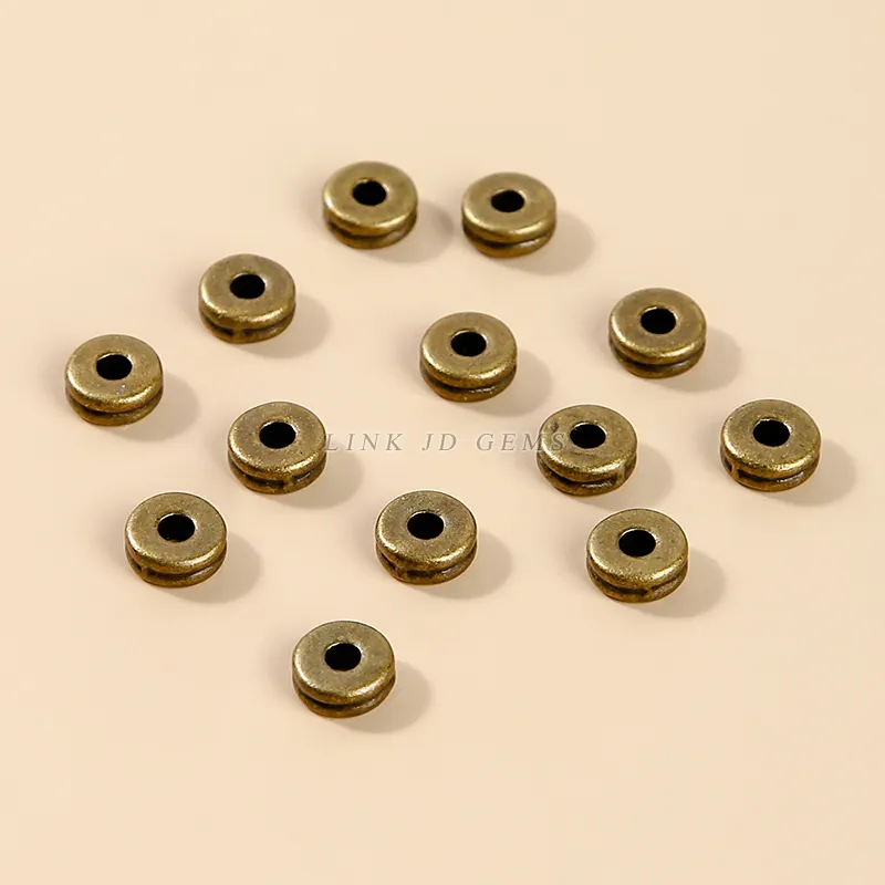Messing Spacer Perlen 6,5*3mm DIY Zubehör 18 Karat vergoldete Metall legierung flache runde Perlen für die Schmuck herstellung