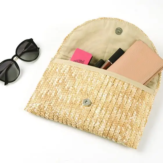 महिलाओं के लिए उच्च गुणवत्ता वाले हस्तनिर्मित थोक ग्रीष्मकालीन समुद्र तट गेहूं के भूसे से बना बैग रंगीन महिला स्ट्रॉ क्लच बैग हैंडबैग