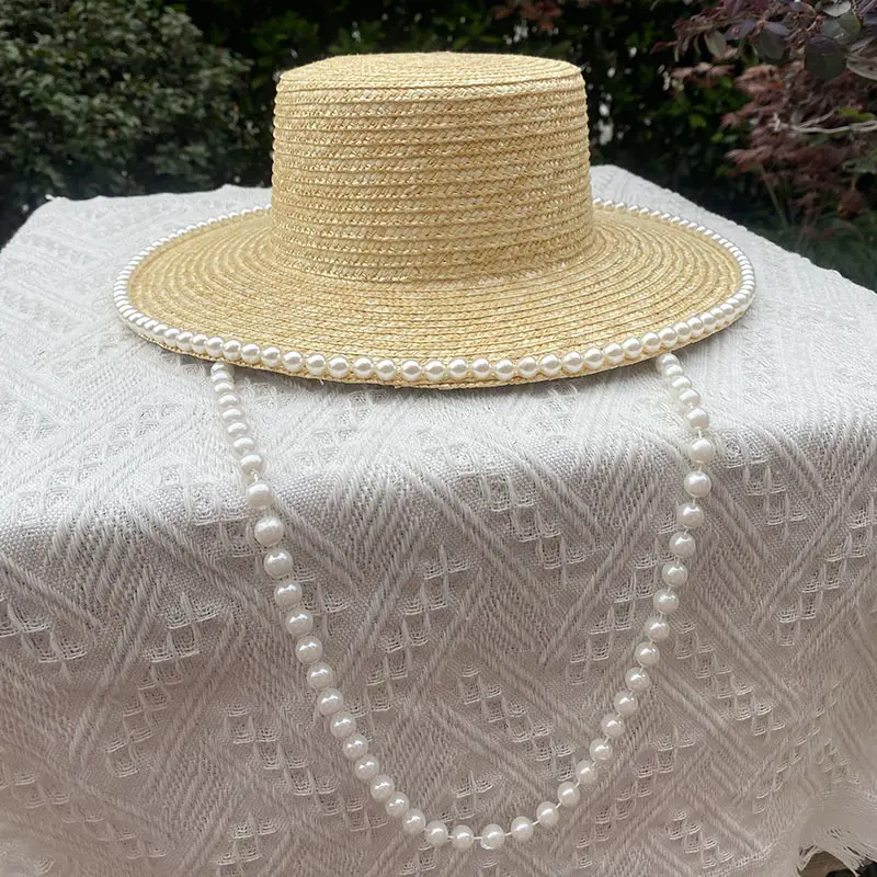 2024 new wholesale women empty top straw sun hat visor hat for women Real grass pearl straw hat   caps
