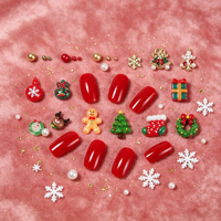 Kit de 24 compartiments de breloques de Noël mixtes pour ongles : perles décoratives en résine en forme de bonhomme en pain d'épices et clous en métal en forme de flocon de neige pour le nail art de Noël DIY