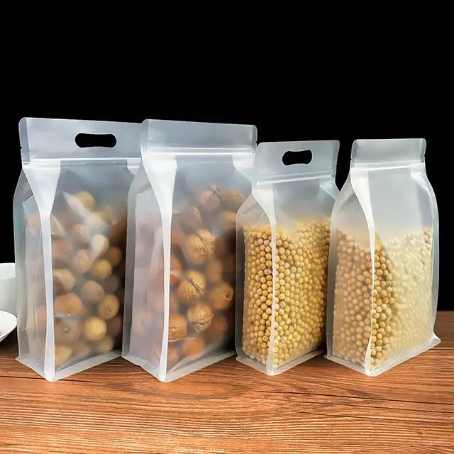 Sac plastique transparent personnalisé à fond plat mat pour aliments debout zip-lock pochette supérieure écrous emballage alimentaire en PET avec poignée