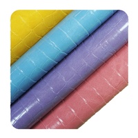 Vente directe usine Tissu en cuir PVC coloré à motif crocodile 1.0 Double aiguille Fond brossé Anti-plis pour mobilier