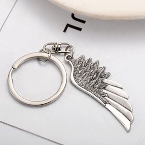 Porte-clés personnalisé rétro en alliage de zinc, style européen et américain, avec pendentif ailes d'ange à plume unique, accessoires de sac, vente en gros - Product Image 1