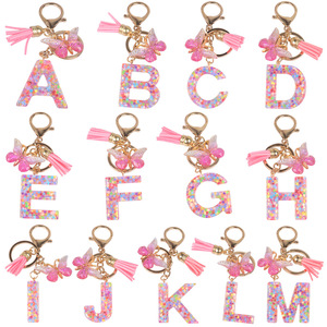 Venta al por mayor nueva moda colorida lentejuelas mariposa borla regalos para niñas mujeres Rosa acrílico 26 letras iniciales en inglés llaveros - Product Image 1