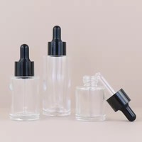 Bouteille en verre givré de forme ronde pour emballage personnalisé de sérum cosmétique, soins de la peau, huile essentielle