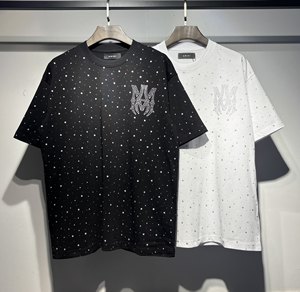 T-shirt da uomo AMI best-seller a maniche corte, alla moda, con stampa all-over e girocollo, in puro cotone, abbigliamento da uomo di marca - Product Image 1