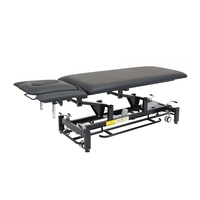 Table de massage électrique de luxe avec interrupteur périmétrique en métal durable de couleur noire