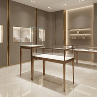 Vitrine de présentation de bijoux de luxe sur mesure avec armoire en verre et acier inoxydable, mobilier de vente au détail à LED pour boutique