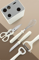 6-in-1 multifunctionele keuken gadget set met opbergbak, schaar, schilmesje, messen, eiermixer en flesopener voor thuisgebruik