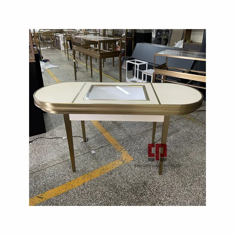 Table ovale en métal et acier inoxydable pour magasin de bijoux de luxe