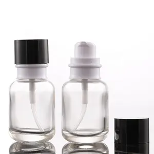 50Ml स्किनकेयर फाउंडेशन सीरम कॉस्मेटिक पैकेजिंग दौर ग्लास लोशन पंप बोतलों के साथ एक्रिलिक टोपी