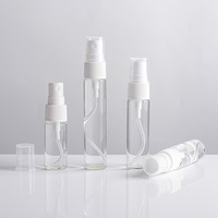 Vente en gros de flacons de parfum ronds plats en verre blanc de haute qualité avec pulvérisateur à pompe, impression d'écran et logo personnalisé pour l'emballage cosmétique