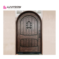 Portes d'entrée doubles résidentielles en bois avec cadre en verre et grille de sécurité personnalisée, design rond en haut