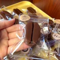 Mainan Genggam Bentuk Biji Kopi Musik Hidung Kecil Karma Pelajar Hadiah Lucu Liontin Penghilang Stres Grosir Model A-62 Kemasan PVC