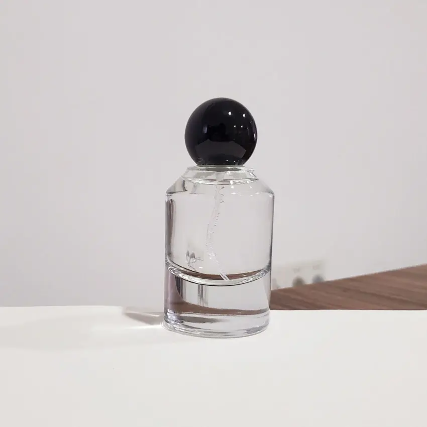 Bottiglia rotonda di profumo in vetro trasparente personalizzato di alta qualità da 50ml