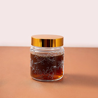 Pot cosmétique vide OEM 120 ml en verre gaufré floral avec couvercle doré pour crème et soins de la peau