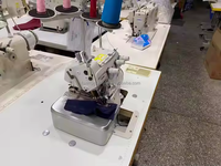 Machine à coudre surjeteuse industrielle Juki 6704DA d'occasion à une aiguille, idéale pour la confection de chemises – Offre Spéciale