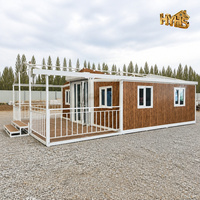 Maison conteneur préfabriquée moderne de 20 pieds, cadre blanc, grain de bois 3D, double ailes, toit incliné, appartement, villa extérieure, usage hôtelier, garantie 5 ans