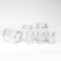 Vente en gros Pot de confiture Pot de miel 45ml 100ml 180ml 280ml 380ml 500ml 730ml Bouteille hexagonale en verre Pot alimentaire