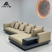 Canapé sectionnel minimaliste italien avec table d'appoint en métal Meubles de salon pour maison moderne Canapé en cuir rembourré en forme de L