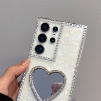 Étui de téléphone de luxe élégant avec strass scintillants et miroir en forme de cœur pour Samsung Galaxy S26 Ultra S25 A55, avec dragonne en cristal
