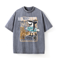 T-shirt surdimensionné en coton tricoté 100 % pour homme noir avec motif requin surfeur et texte « King Sea », écologique, idéal pour les tenues décontractées de plage