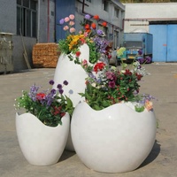 Maceta de Fibra de Vidrio Yuwei Yuwei-F en Forma de Huevo, Acabado Tallado a Mano, Diseño Moderno y Ecológico, Duradera, para Interiores/Exteriores
