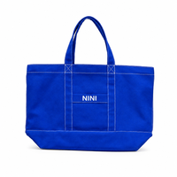 Sac fourre-tout en toile bleue avec logo personnalisé, sac à bandoulière robuste pour bateau et transport, surpiqûres contrastées blanches, sac à main réutilisable pour le voyage et le shopping