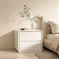 Table de chevet minimaliste moderne avec glissières silencieuses, coins arrondis et design compact pour le rangement de la chambre à coucher