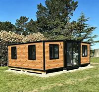 Maison conteneur extensible polyvalente de 20 pieds, finition bois, pour habitation en milieu forestier