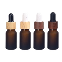10 ml givré brun essentielle de bouteille en verre cosmétique paquet 10 ml givré ambre cosmétique bouteille avec 18/410 en bois gouttes