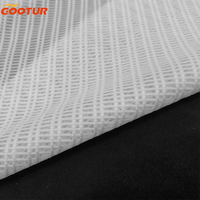 Tissu tricoté en maille respirante avec conception à grille 93% Polyester 7% Spandex Textile pour la fabrication de gilets de course et de vêtements de sport