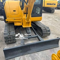 Mini-excavatrice sur chenilles Komatsu PC56 5T d'occasion avec moteur et système hydraulique fiables, idéale pour les travaux de construction et de terrassement