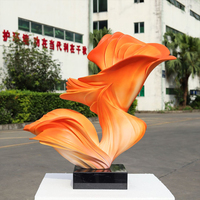 Sculpture en ruban torsadé en fibre de verre dégradé orange, base en marbre sculpté, pour décoration artistique de sol de hall d'hôtel Jingyue