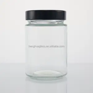 Clear Glass Storage Jar With Wooden Clip Lid and Black Metal