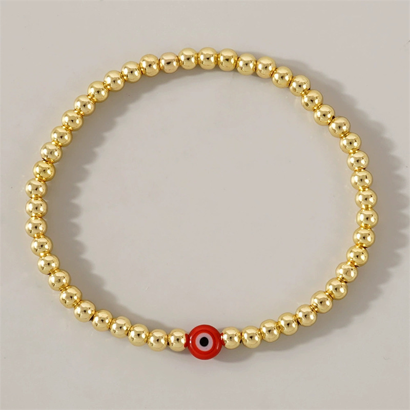 Golden beaded Red Devils Eye (No card)