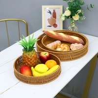 Panier de rangement rond tissé en rotin Plateau de nourriture domestique Panier en rotin multi-modèle personnalisé